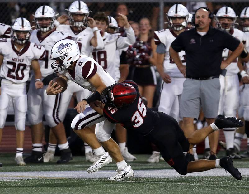 Prairie Ridge's Luke Vanderwiel is tackles by Huntley's Dominic Giuseffi while returning the opening kick during a Fox Valley Conference football game on Friday, Sept. 20, 2024, at Huntley High School.