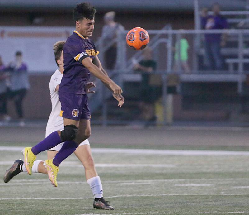 Mendota's Ricky Orozco (9) puts a header on the ball against Bloomington Central Catholic on Wednesday, Sept. 14, 2022 in Mendota.