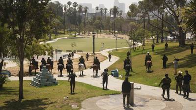 Troops and federal agents briefly descend on LA’s MacArthur Park in largely immigrant neighborhood