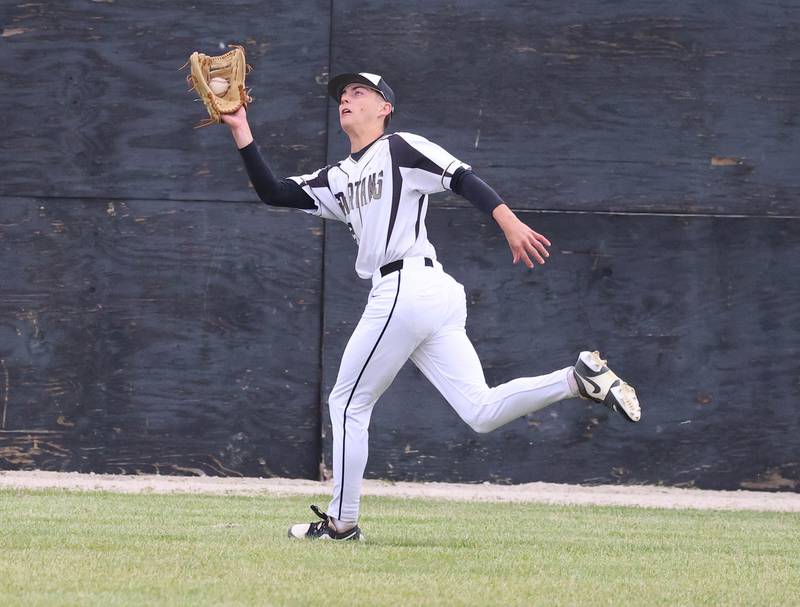 Sycamore's Benjamin Anderson makes a running catch Wednesday, May 13, 2026, during their game against Morris at the Sycamore Community Sports Complex.