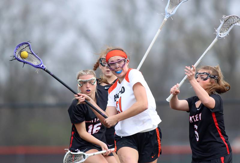 Crystal Lake co-op’s Anna Starr moves the ball against Huntley in varsity girls lacrosse on Friday, April 18, 2025, at Metcalf Field on the campus of Crystal Lake Central High School in Crystal Lake.