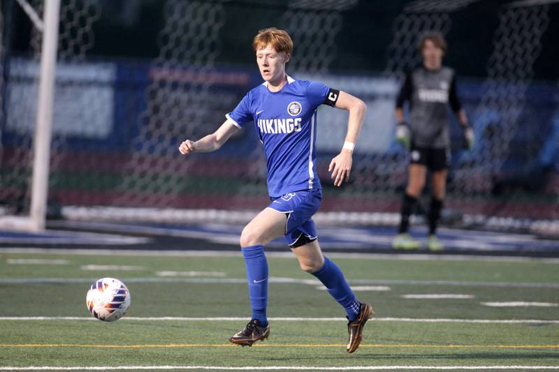 Geneva’s Liam O’Donoghue goes after the ball during a Tri-Cities Night game against Batavia at St. Charles North High School on Thursday, Sept. 21, 2023.