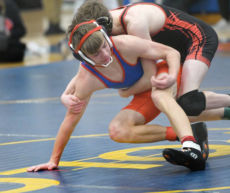 Oregon's Jackson Messenger tries to escape a hold by Dakota's Jerry Knight in the third-place match at 113 pounds at the 1A Polo Wrestling Regional held at Eastland High School on Saturday, Feb. 4.