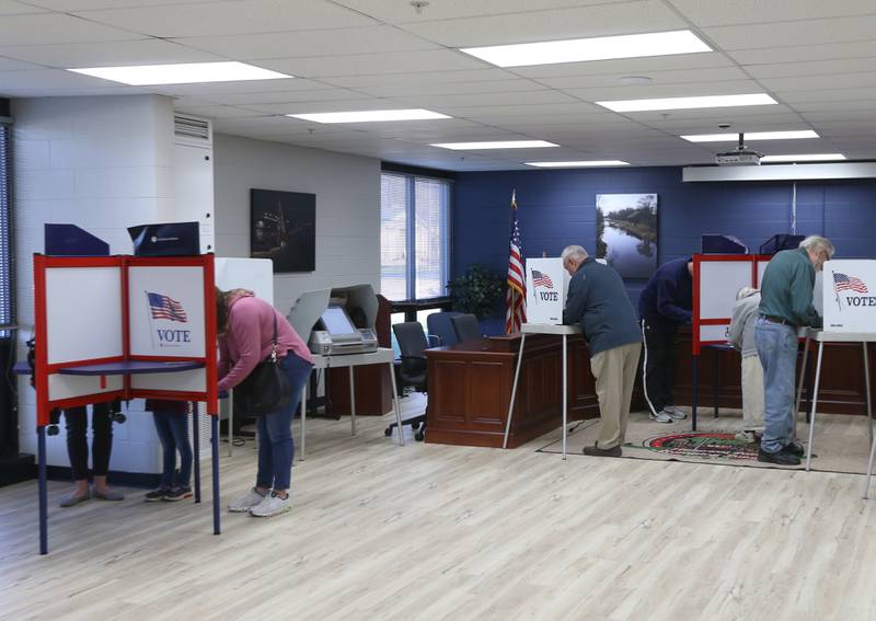 Voters fill their ballots out at the Village Hall on Tuesday, Nov. 8, 2022 in Utica.