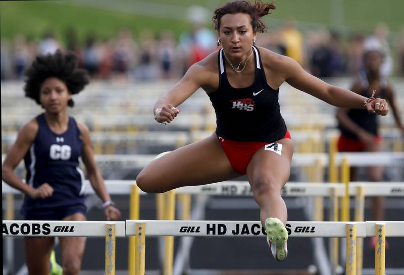 Huntley’s Sophie Amin  clears the last hurdle  as she wins the 100 meter hurdles on Thursday, May 2, 2024, during the Fox Valley Conference Girls Track and Field Meet at Jacobs High School in Algonquin.