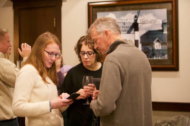 Supporters for Downers Grove Mayor Bob Barnett gather together as poll results come in at Emmett's Brewing on Tuesday, April 4,2023 in Downers Grove.