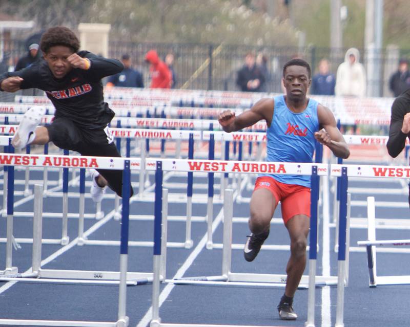 DeKalb's Adam Allen and West Aurora's Azuriah Sylvester compete in the 110 Meter Hurdles at the Peterson Prep Invitational by Kaneland on Saturday, April 20,2024 at West Aurora High School in Aurora.