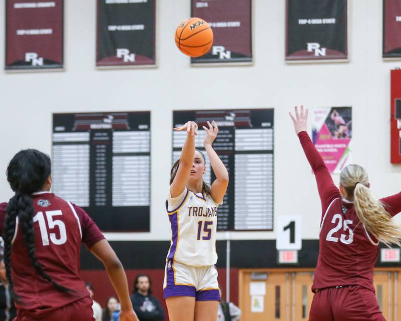 Downers Grove North's Adysen Fanta (15) shoots a jumper during their Regional Final basketball game between Downers Grove North at Plainfield North. Feb 20, 2025 in Plainfield.