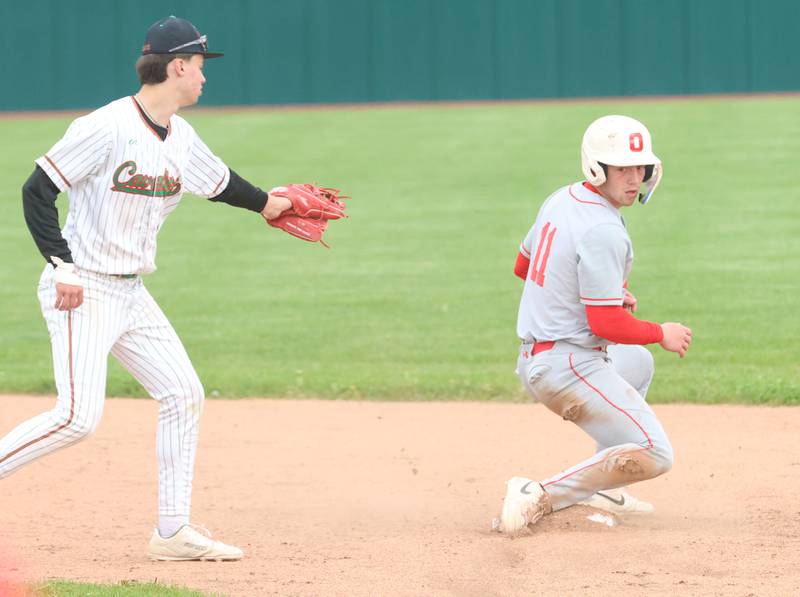 Ottawa's Adam Swanson steals second base as L-P's Jett Hill misses the tag on Thursday, April 30, 2026 at Huby Sarver Field in the L-P Athletic Complex in La Salle.