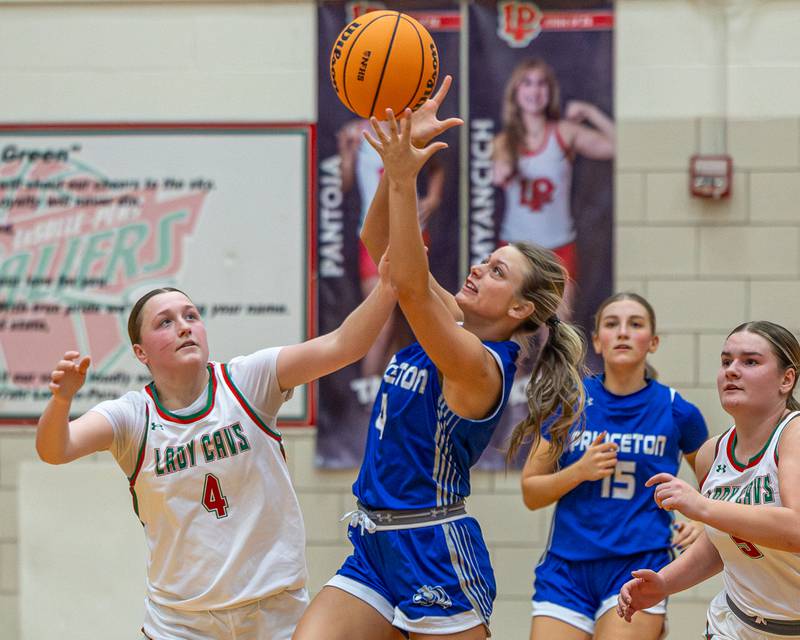 Madie Gibson (4) of Princeton and L-P's Alexus Hines (4) reach for loose ball on Saturday, Feb. 7, 2026 in Sellett Gymnasium at L-P High School.