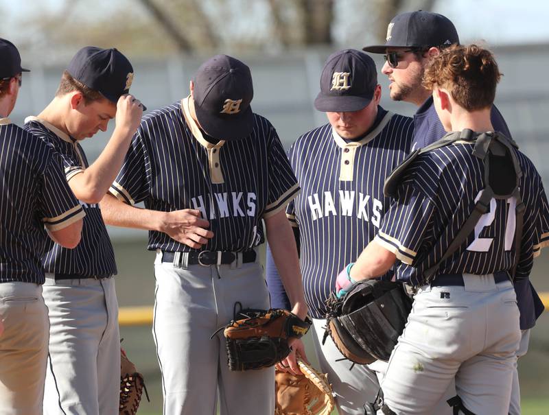 Hiawatha head coach Steven Kenyon visits the mound Tuesday, April 29, 2025, during their game against Hinckley-Big Rock at Hiawatha High School in Kirkland.