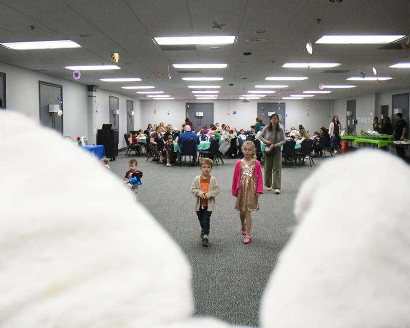George Sharbauh, 3, and his sister Lucille Sharbaugh, 8, approach the Easter bunny with their mom Rebecca of Brookfield on Saturday March 29, 2025, during the breakfast with the bunny event held at the La Grange Park District Recreation Center.