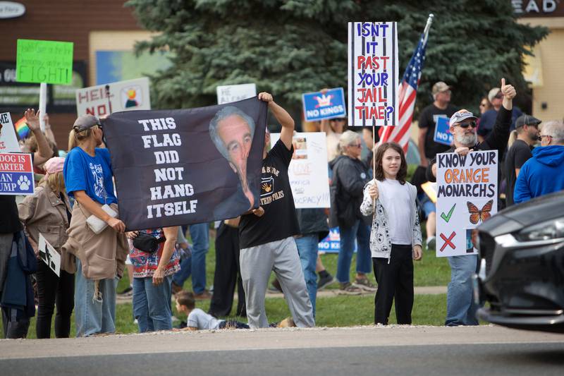 Locals gather at the NO Kings rally along Randall Rd. on Saturday, Oct.18,2025 in Geneva.
