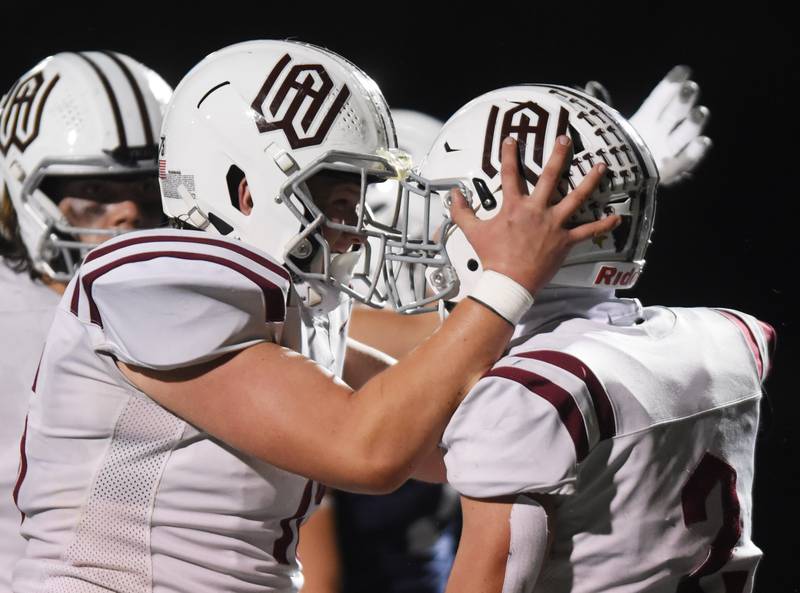 Wheaton Academy's Brandon Kiebles, right, celebrates his second-quarter touchdown with treammate Jay Krueger during a 2023 Class 4A football playoff game against St. Viator in Arlington Heights.