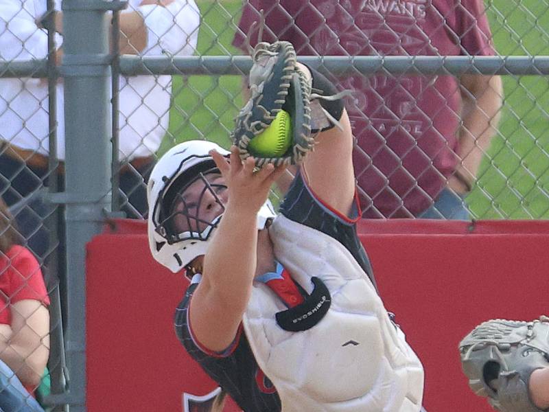 Ottawa catcher Bobbi Snook makes an out while catching a ball in foul territory on Tuesday, April 14, 2026 at Ottawa High School.