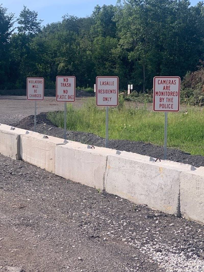 A number of signs warn residents in La Salle not to illegally dump at the leaf drop off facility on Eagle Drive.