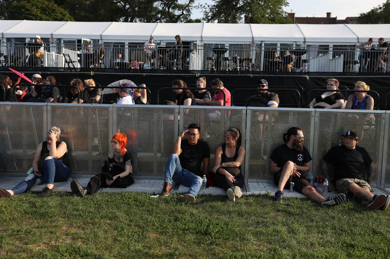 Festival goers take a break on day one of Riot Fest which featured 30 bands. Friday, Sept. 17, 2022, in Chicago.