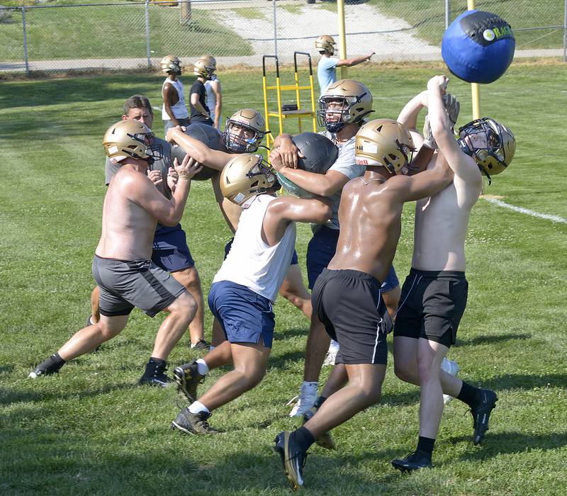 The Marquette Crusaders began their first practice Monday at the Gould Field complex with a variety of drills and workouts to prepare for the upcoming 2025 season.