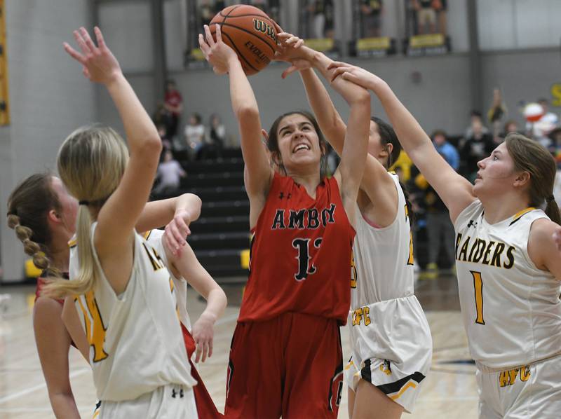 Amboy's Tyrah Vaessen (11) draws a crowd of AFC defenders and is fouled as she goes up for a shot during a Feb. 7 game in Ashton.