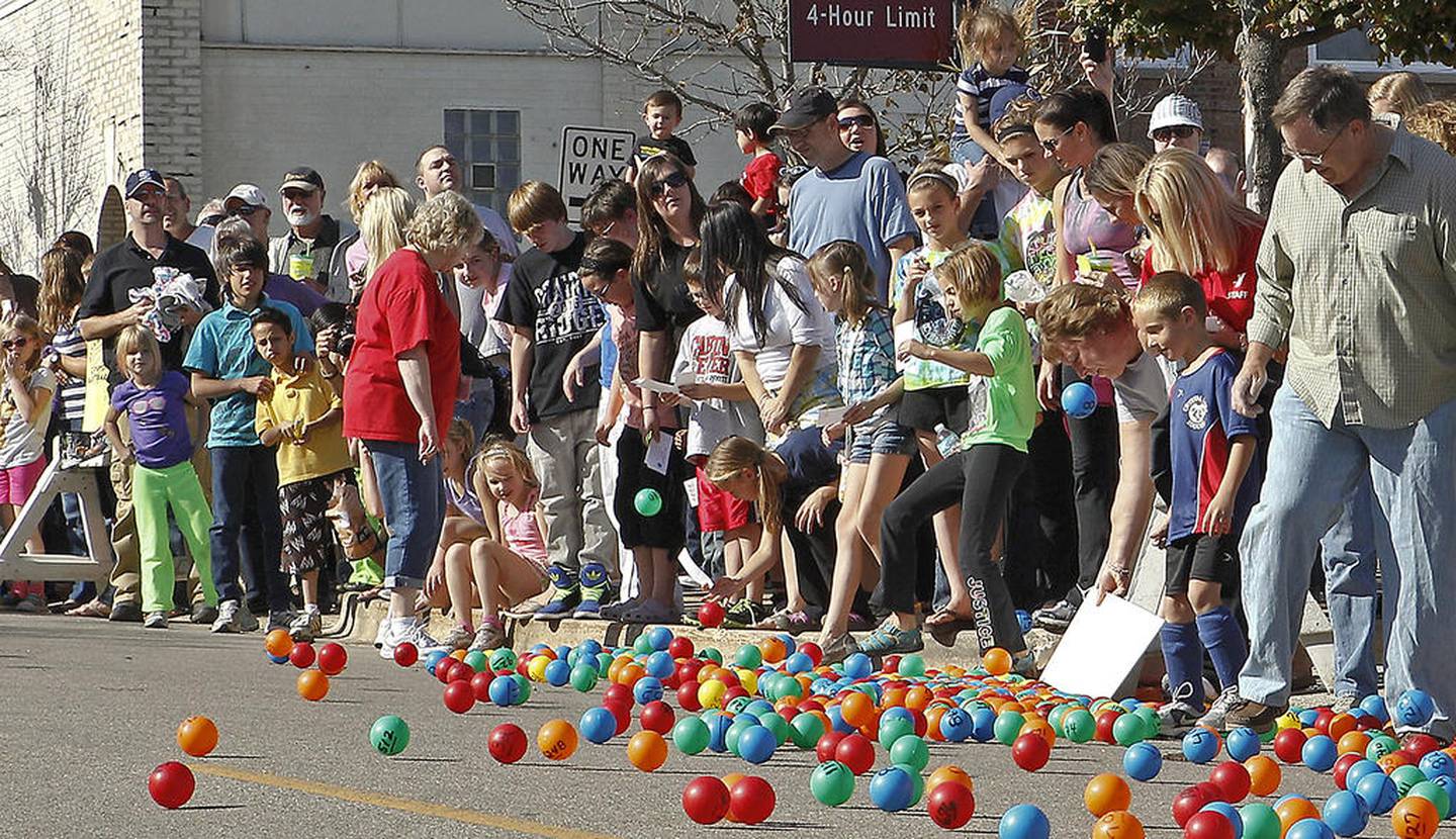 Spectators watch for their numbered ball in hopes of winning the Great Ball Race on Saturday, Sept. 29, 2012, at the Johnny Appleseed Festival in downtown Crystal Lake.