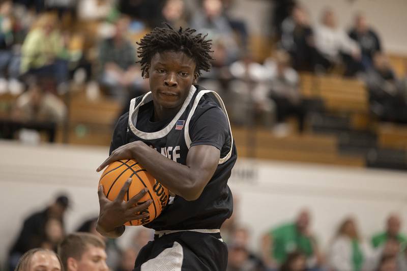 Kewanee’s Dontaveon Thomas hauls in a rebound against Rock Falls Wednesday, Nov. 27, 2024, at Rock Falls High School.