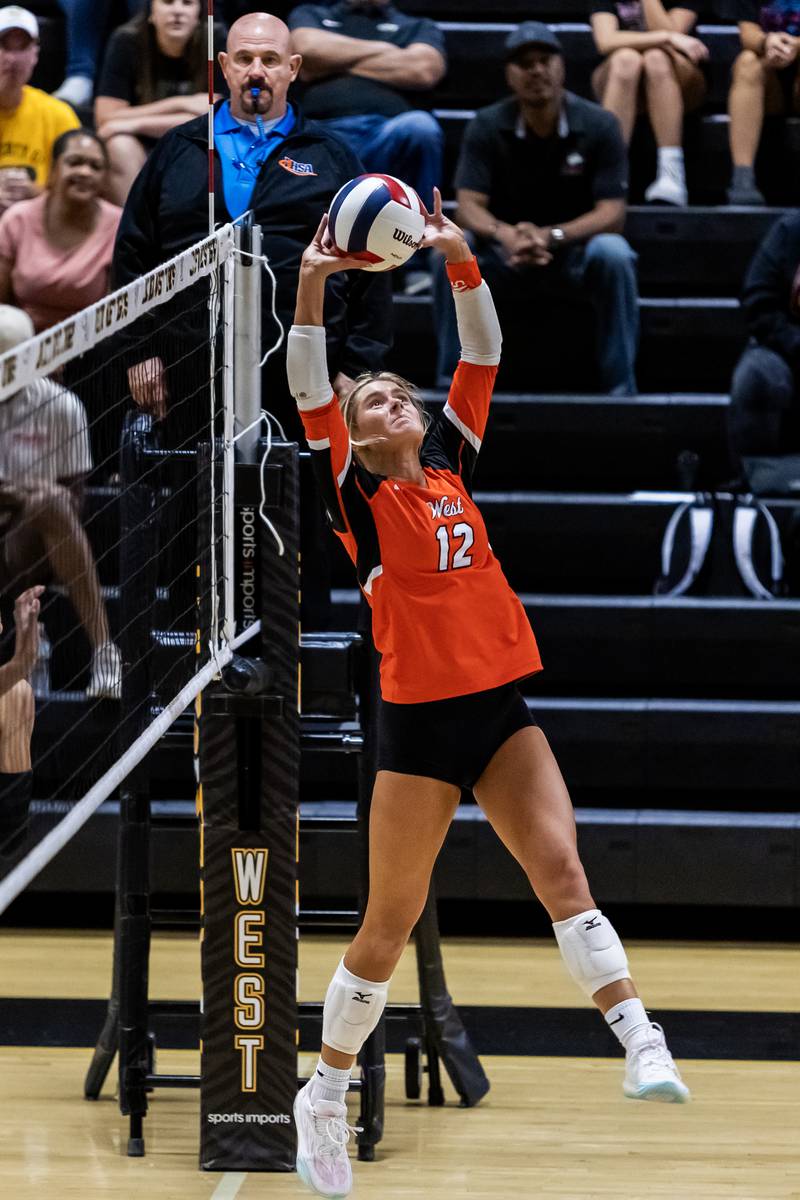 Lincoln-Way West's Kynzi Markowicz sets up a teammate during a varsity volleyball away game against Joliet West on Sept. 15, 2025.