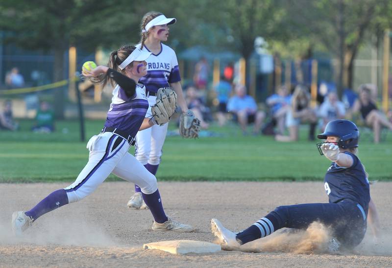 Downers Grove North shortstop Payton Janicki throws to first base after forcing out Downers Grove South's Grace Taylor (9) during a game on May. 12, 2022 at McCollum Park in Downers Grove.