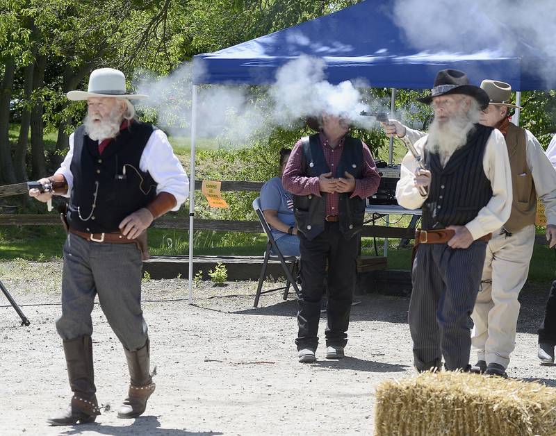 A group of gunslingers fire at Wild Bill Hickok on Saturday, May 27, 2023, during a reenactment at Wild Bill Days in Utica.