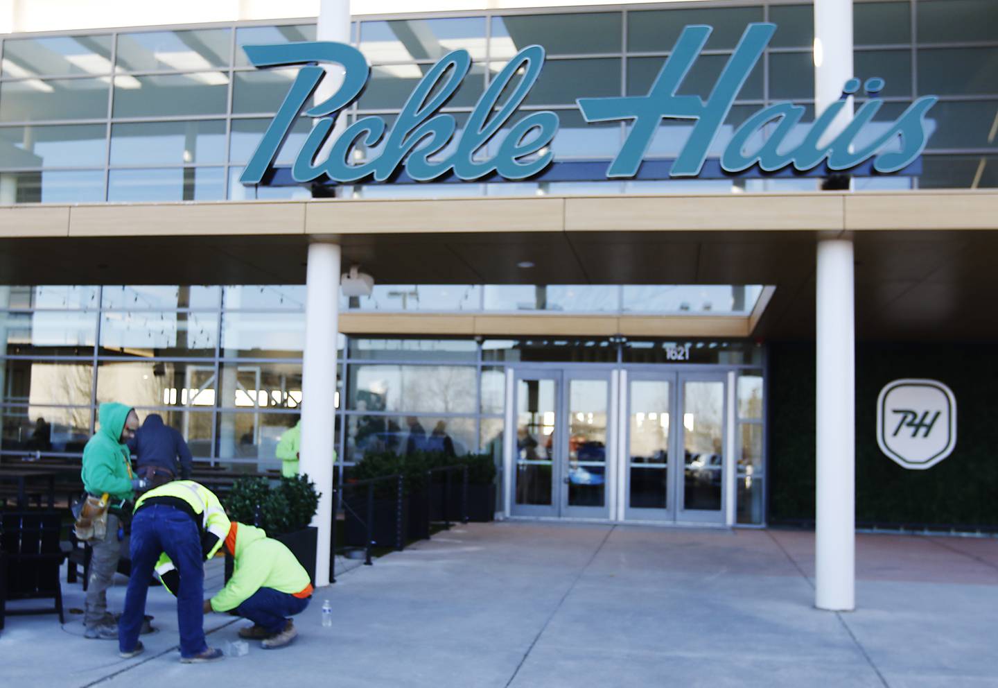 Workers put the finishing touches on the patio area of the new Pickle Haus in Algonquin, on Friday, Nov. 10, 2023. The Pickle Haus offers indoor pickle ball courts, food and drinks.