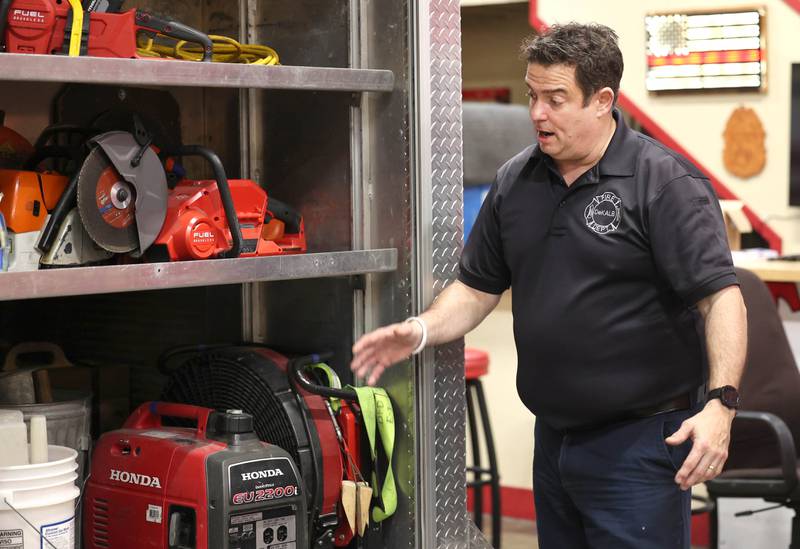 DeKalb firefighter/paramedic Pat Eriksen talks Wednesday, April 17, 2024, at the DeKalb Fire Department Fire House No. 1, about the gear the truck he drives carries on board.