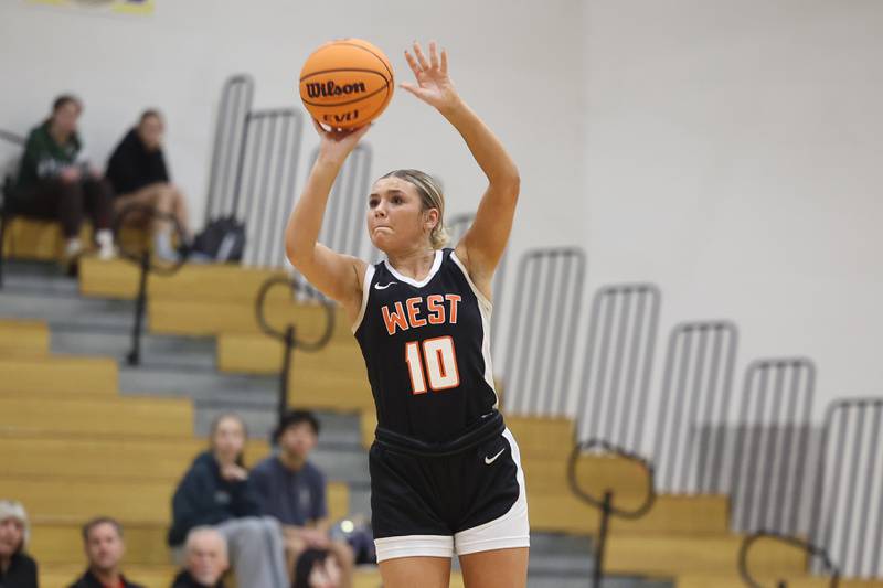Lincoln-Way West’s Molly Finn puts up the outside shot against Lincoln-Way Central on Tuesday, Jan 28, 2025 in New Lenox.