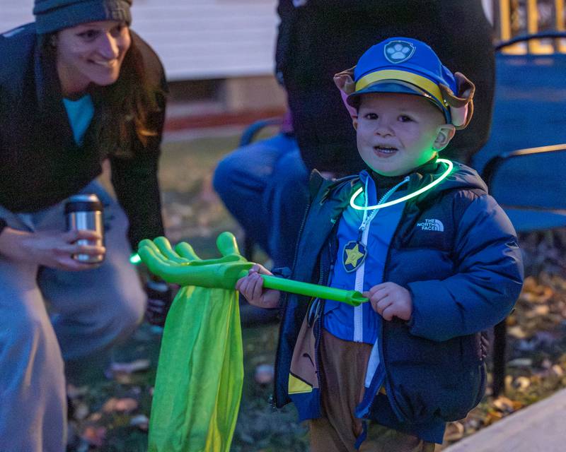 Matthew Mertens holds Trick-Or-Treat bag on Friday, October 31, 2025 on Hopkins Ave. in Granville.