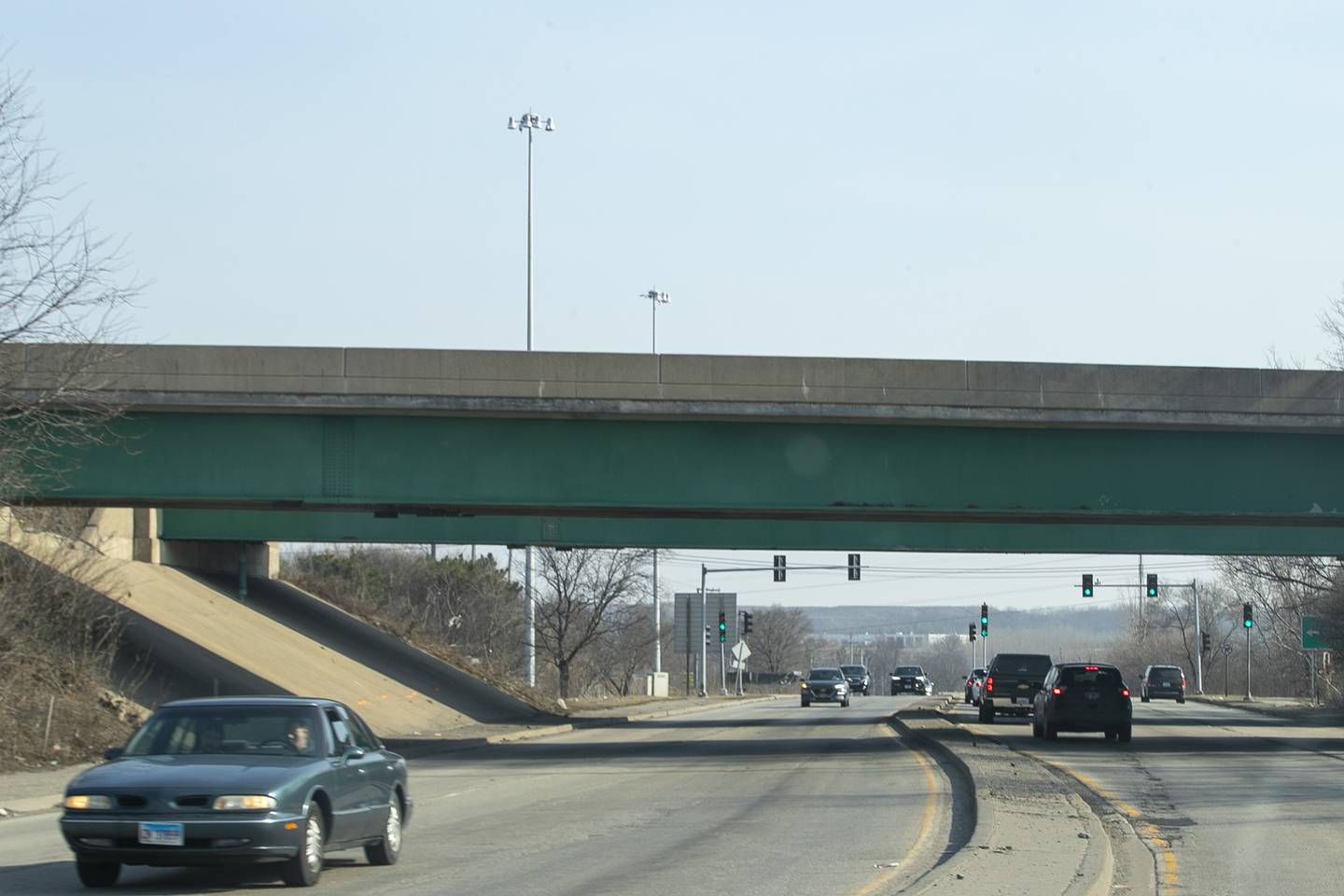 Cars pass pass under the I-80 bridge at Houbolt Rd. on Tuesday, March 9, 2021, in Joliet, Ill. A bridge across the Des Plaines River is proposed at the intersection of Rt. 6 and Houbolt Road.