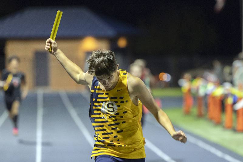 Sterling’s Carter Chance crosses the finish in the 4x200 Thursday, April 25, 2024 at the Sterling High School Night Relays.