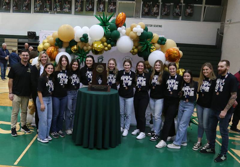 Members of the St. Bede girls basketball team and their coaches pose with the Class 1A fourth-place trophy during a celebration ceremony on Tuesday, March 5, 2024 in Abbot Vincent Gymnasium.