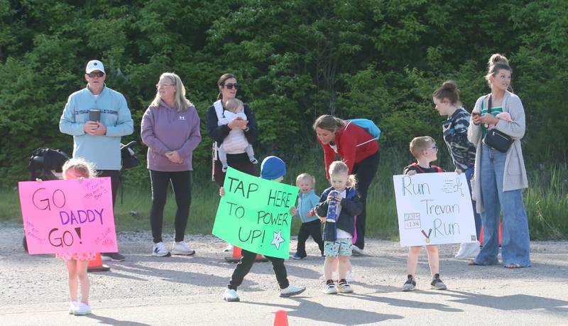Kids and adults cheer on the runners as they pass Grand Bear Lodge during  the Starved Rock Country Marathon and half-marathon on Saturday, May 10, 2025 at Starved Rock State Park.