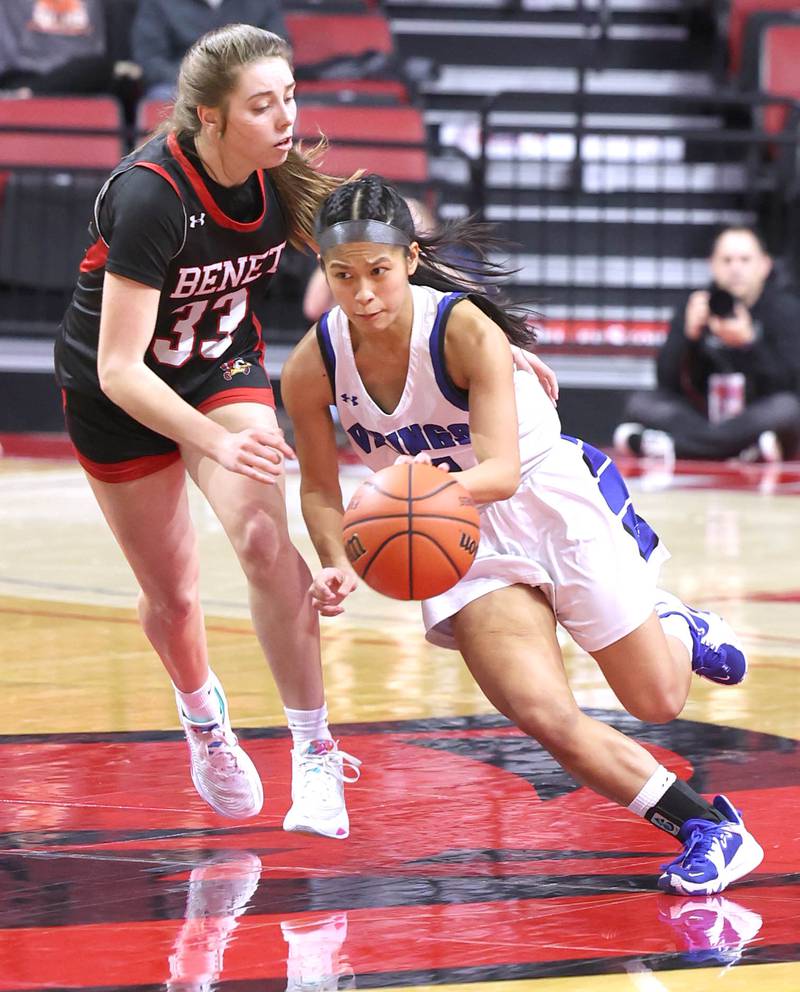 Geneva's Rilee Hasegawa pushes the ball ahead of Benet’s Magdalena Sularski during their Class 4A state semifinal game Friday, March 3, 2023, in CEFCU Arena at Illinois State University in Normal.