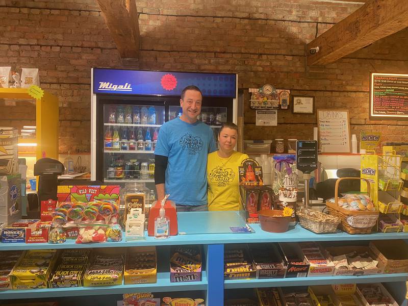 Kevin Orf and his wife Tarra Dub stand behind the counter of Sweet Tooth.