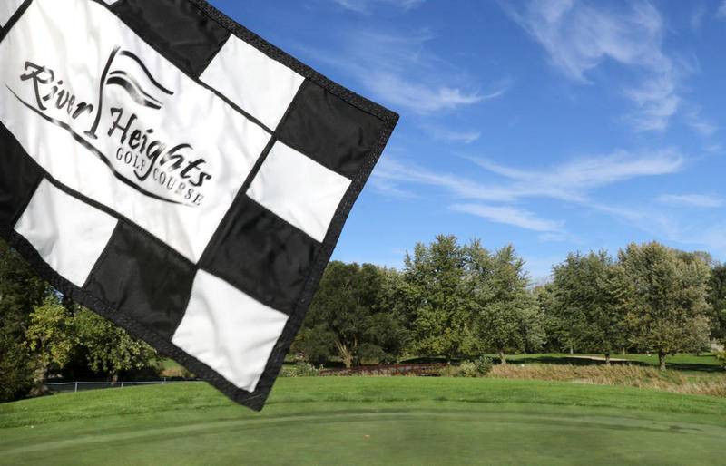The flag on the 18th green waves Monday at River Heights Golf Course in DeKalb.