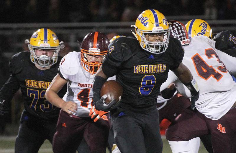Warren's Malachi McNeal runs the ball against Brother Rice in the fourth quarter during the Class 8A state semifinals Nov. 23 at Warren Township High School in Gurnee. Warren won, 28-0.