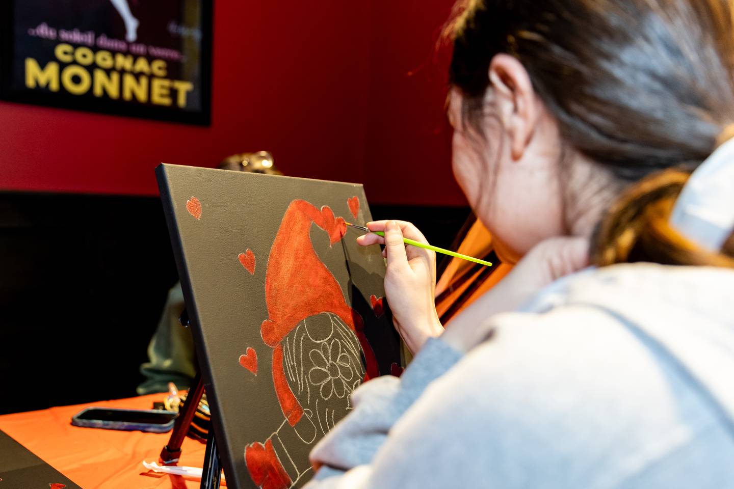 Lockport resident Morgan Lindemann works on a “Be My Valentine Gnome” during Divine Design Paint Studio's paint party at Papa Joe's in Lockport on Feb. 6, 2025.