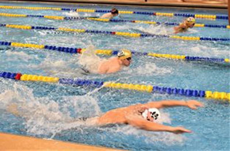 Sterling and Byron swimmers compete in the 100 butterfly race during a dual meet Tuesday afternoon at the Duis Center.