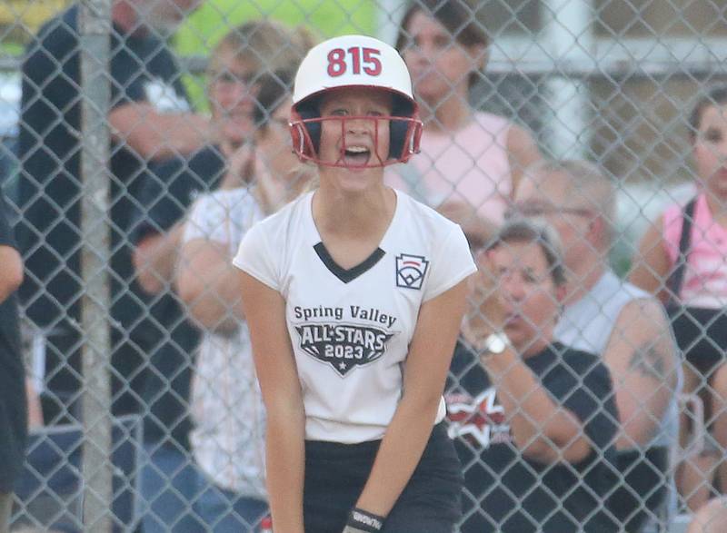 Spring Valley's Vivi Verucchi react after standing on third base while facing Evergreen Park in the Minor League Softball State title game on Thursday, July 27, 2023 at St. Mary's Park in La Salle.