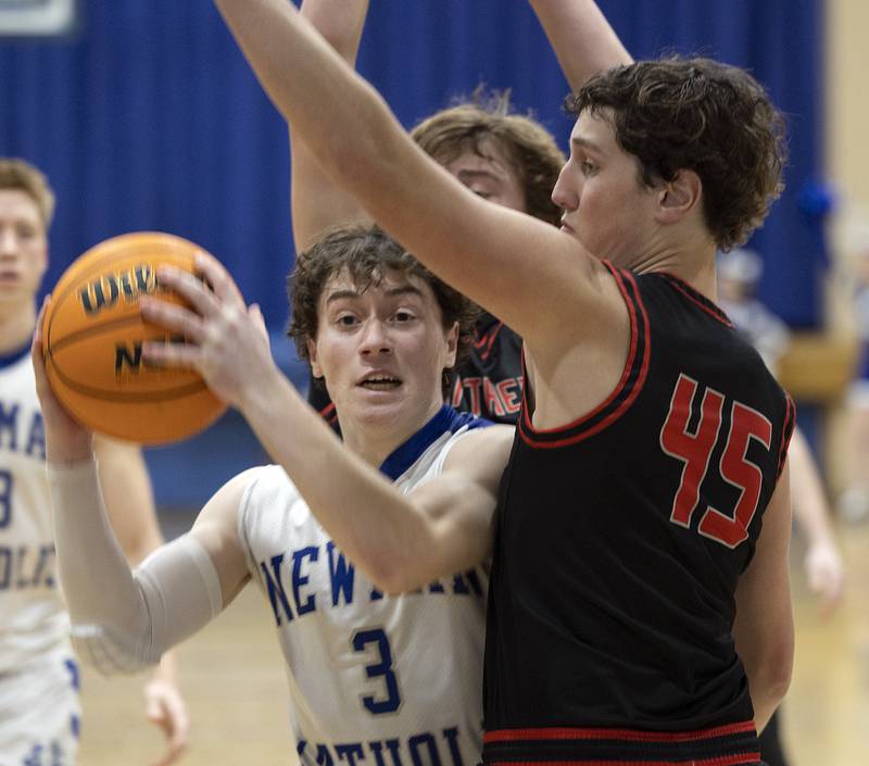 Newman’s Garret Matznick works below the basket against Erie-Prophetstown’s Gus Schultz Wednesday, Jan. 29, 2025, at Newman High School.