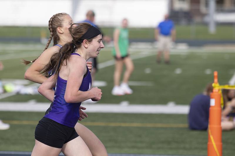 Dixon’s Emily Conderman races to the finish in the 3200 run Thursday, May 11, 2023 at the class 2A Sterling girls track sectionals.