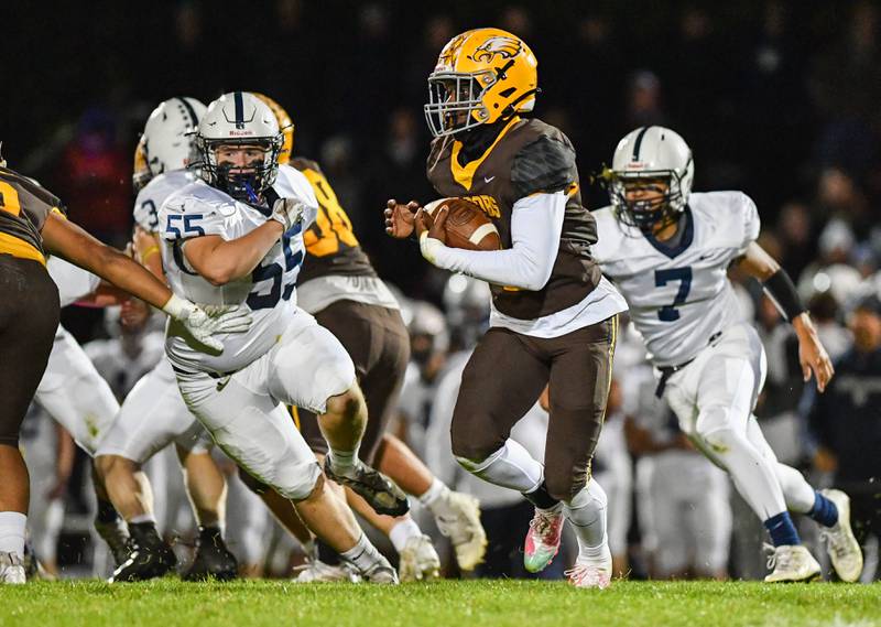 Jacob's Antonio Brown runs for yardage during their Fox Valley Conference game against Cary Grove on Friday, Oct. 6, 2022 in Algonquin.