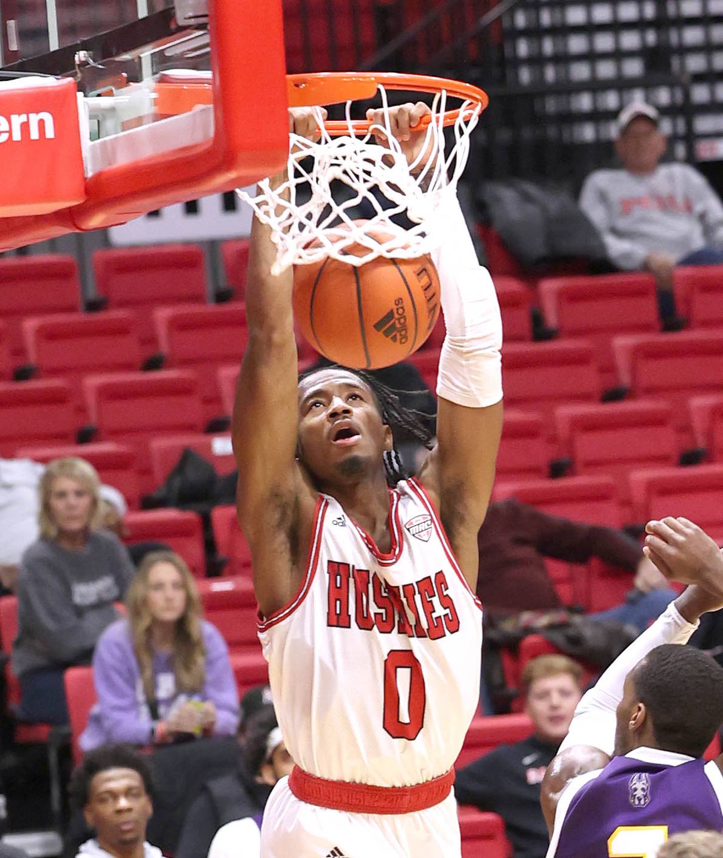 Northern Illinois Huskies guard Keshawn Williams slams home a basket during their game against Albany Tuesday, Dec. 20, 2022, in the Convocation Center at NIU in DeKalb.