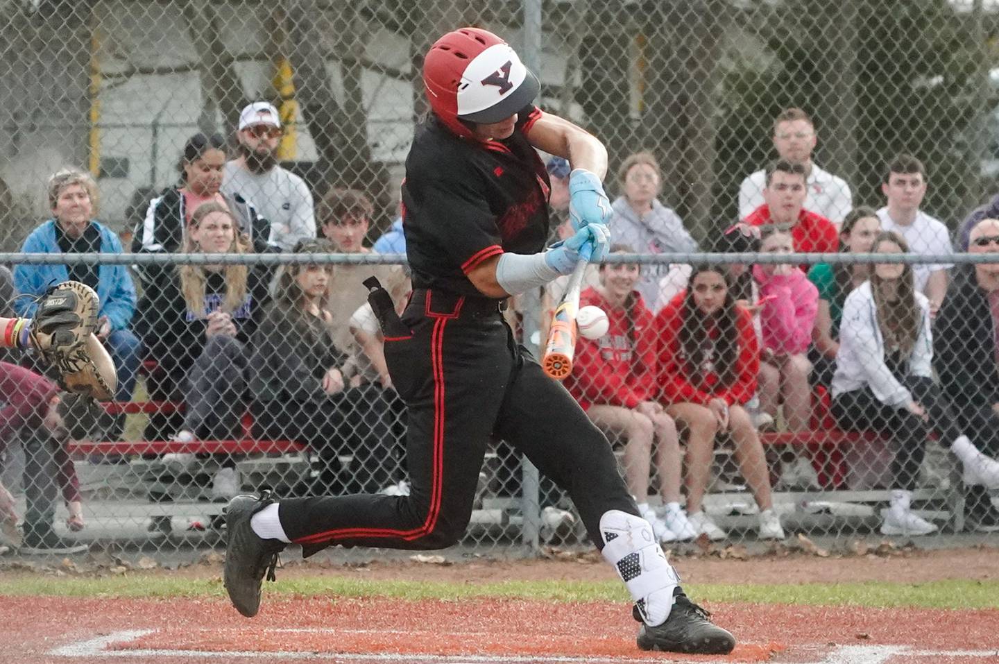 Yorkville's Jailen Veliz (12) singles against Lincoln-Way Central during a baseball game at Yorkville High School on Tuesday, March 12, 2024.
