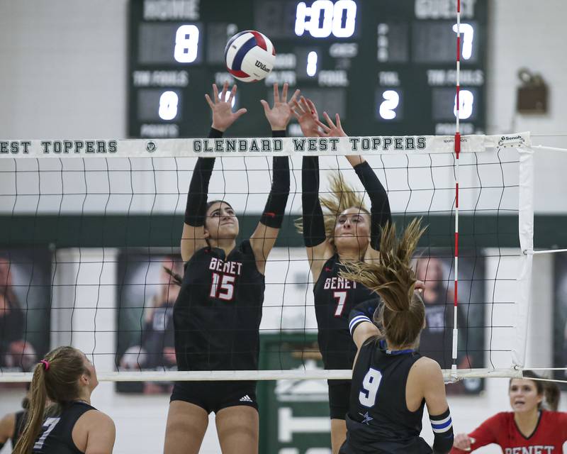 Benet's Sophia Youssef (15) and Sophia Chinetti (7) goes for a block during Class 4A Glenbard West Sectional final volleyball match between St Charles North at Benet. Nov 6, 2025 in Glen Ellyn.