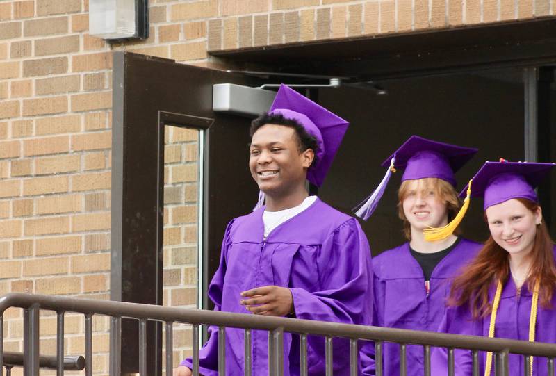 Members of the Dixon High School Class of 2023 leave the high school and begin the processional into the stadium on Sunday, May 28, 2023.